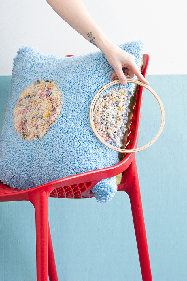 Learn how to make these planet-inspired punch needle throw pillows using embroidery hoops! 