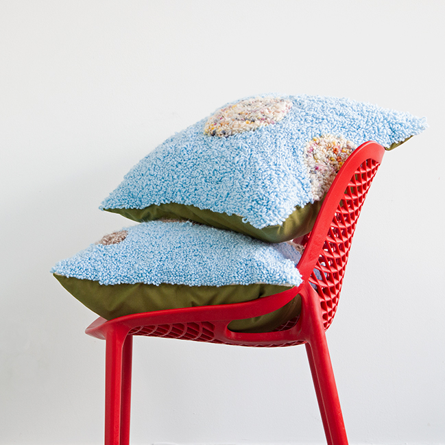 Learn how to make these planet-inspired punch needle throw pillows using embroidery hoops!