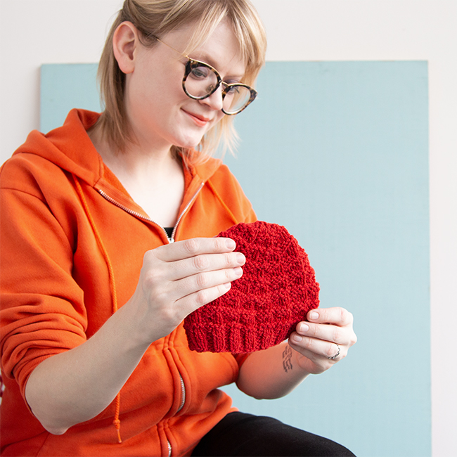 The Triangle Rib Baby Hat knits up so quickly! Get your hands on this free charity knitting pattern for babies on Hands Occupied. #charityknitting #freepattern #babyknitting