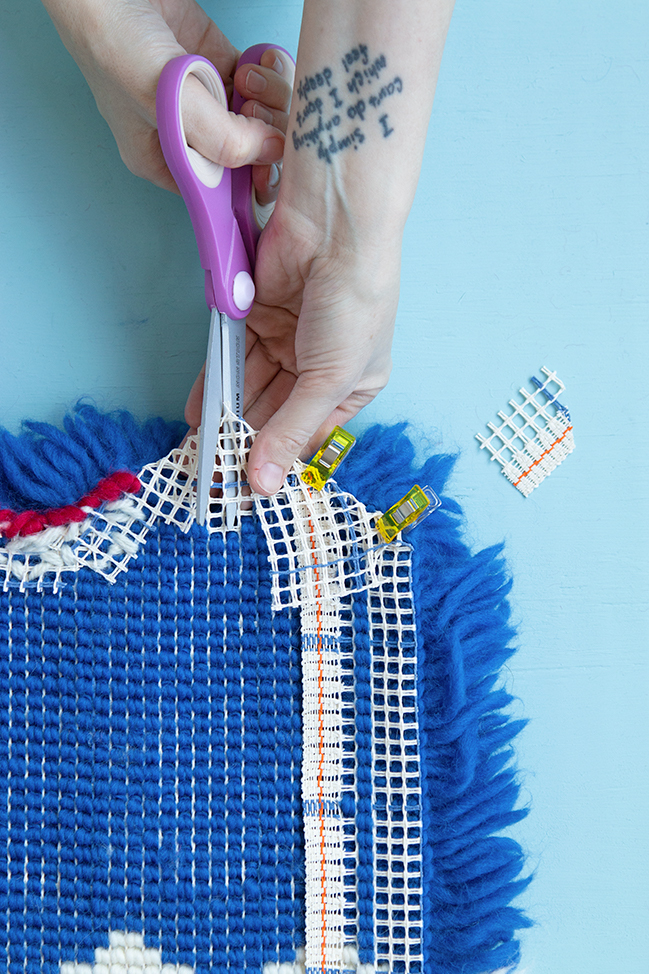 Finishing Nooks and Crannies in Latch Hook Tutorial: The hardest part about finishing latch hook projects is dealing with small nooks and crannies. What do you do when your edge has no seam allowance? What to do when edges are fraying before your eyes? Learn how to troubleshoot challenging finishing spots in this new latch hook tutorial from Hands Occupied.