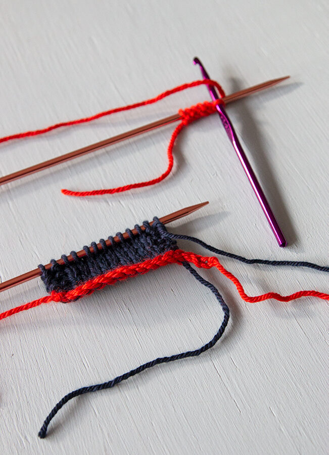 Learn how to work a provisional cast on in knitting. This popular method uses scrap yarn and a crochet hook.