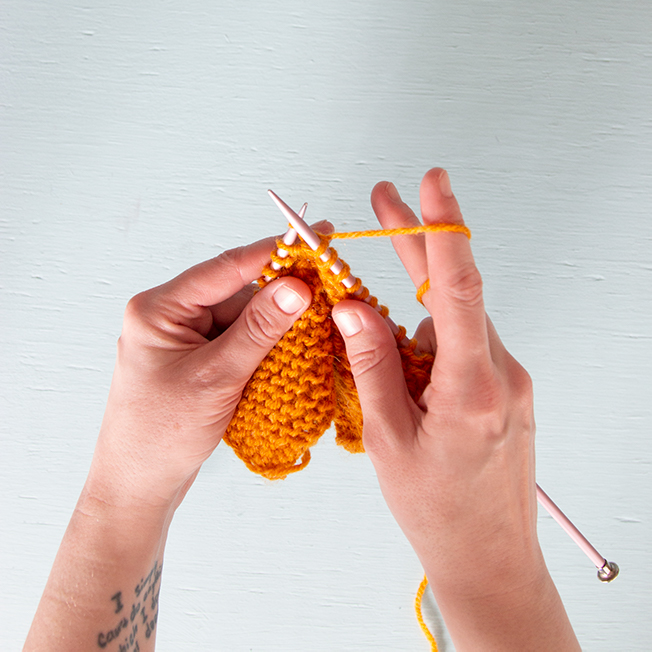 Learn the difference between continental (picking) and throwing (English) style knitting.