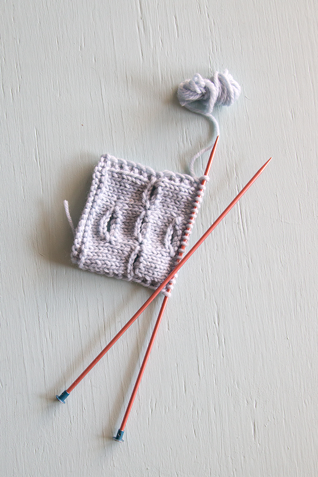 Learn how to knit a buttonhole over the course of a single row of knitting, also known as a one-row buttonhole. In this technique, a combination of binding off and casting on stitches on opposite sides of the work creates a symmetrical, stretchy buttonhole.