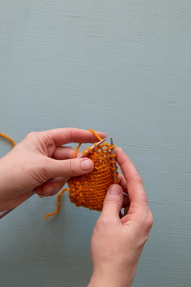 A Left Lifted Increase (LLI) is a way to increase your stitch count by adding a stitch that leans to the left in between two columns of stitches.