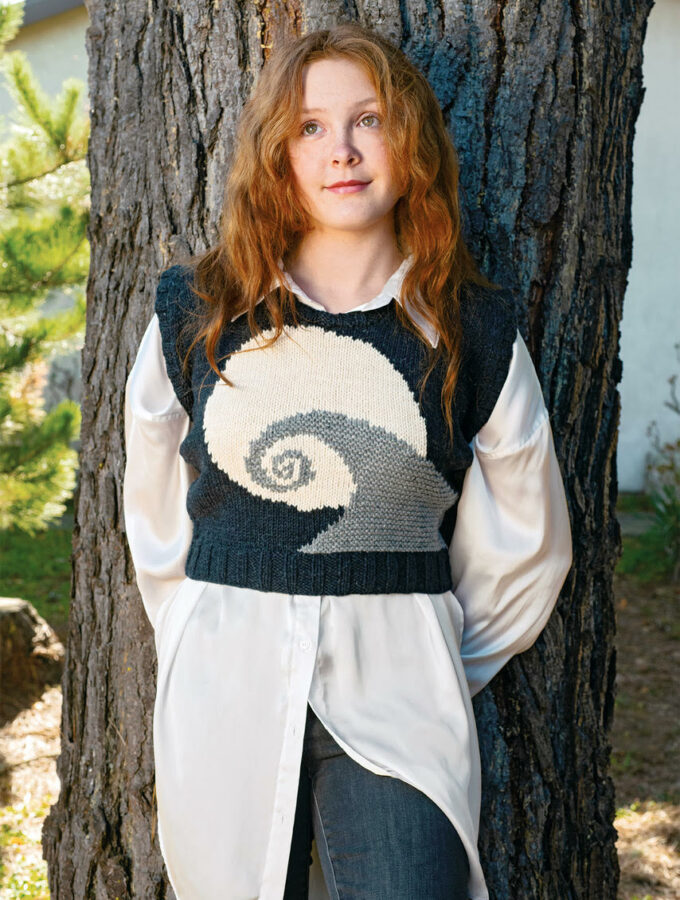 Get the Spiral Hill Sweater Vest pattern, inspired by the new Nightmare Before Christmas knitting book from Tanis Gray and Insight Editions. Designed by Heidi Gustad.